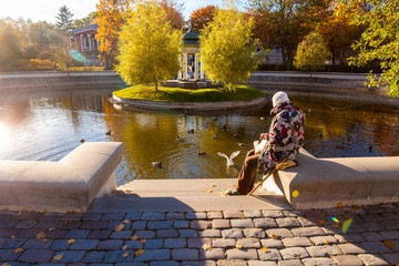 Senior in autumn park