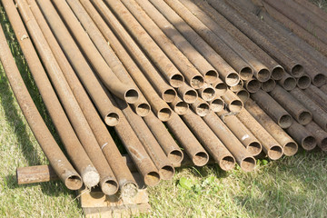 Stack of rusty steel pipes.