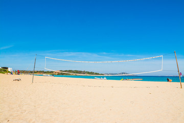 beach volley net and rubber boats in Porto Pollo