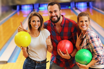 Friends playing bowling