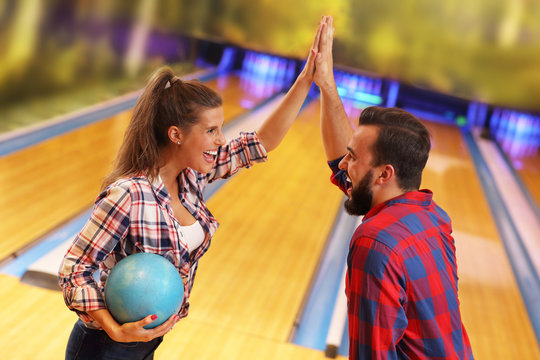 Friends playing bowling