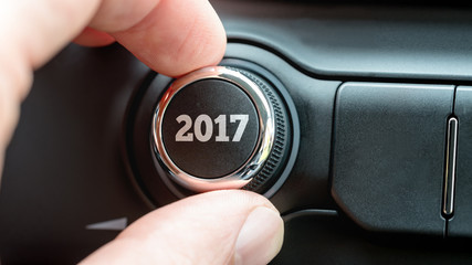 Hand adjusting button dial with 2017 text