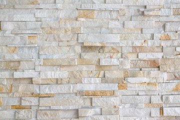 Pattern of grey and rough sandstone wall texture and background, stone Cladding wall