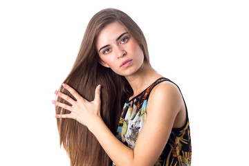 Fototapeta premium Young woman touching her hair 