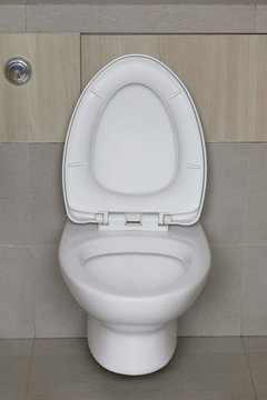 Modern Toilet bowl in a men bathroom.