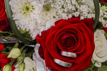 wedding rings with bridal bouquet 