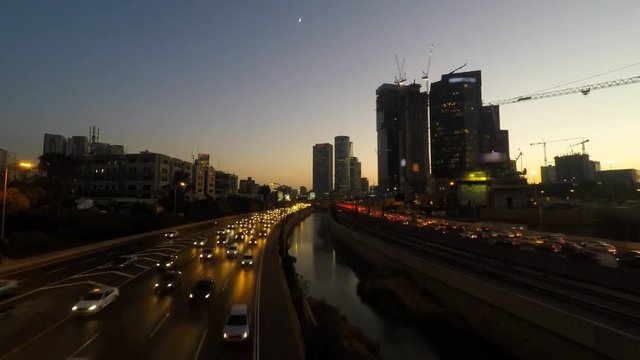 Time lapse - Central Tel Aviv skyline day to night with traffic
