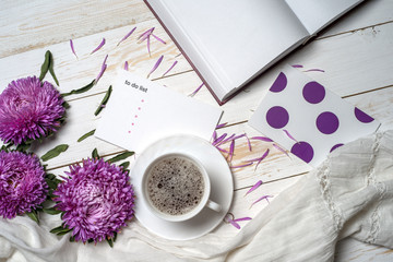 Fototapeta na wymiar Word relax with cup of coffee and pink flowers