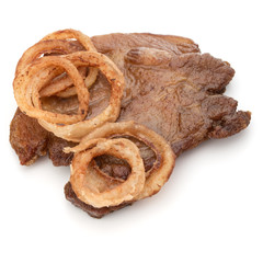 Cooked fried pork meat with onion slices garnish isolated on whi
