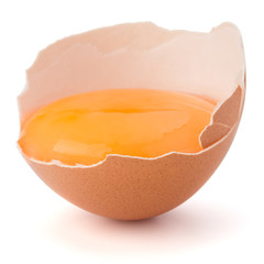Broken egg  in eggshell half isolated on white background cutout