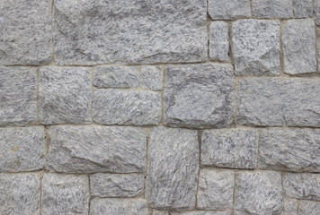 Pattern of grey and rough stone wall texture and background, stone Cladding wall