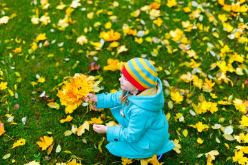 Little girl outdoors on autumn day