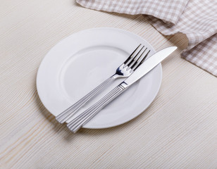 Empty plate on tablecloth