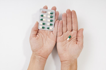 Medicine pills or capsules in hands