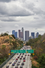 View of the infamous Los Angeles traffic accompanied by its famous skyline