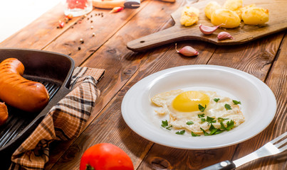 couple grilled sausages and  fried egg