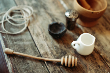 wooden honey stick on old wood background