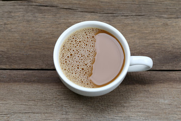 hot coffee in a white Coffee cup on wooden table.