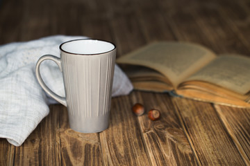 cup of coffee with book in coffee shop vintage color