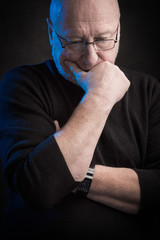 serious man with glasses