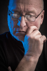 serious man with glasses