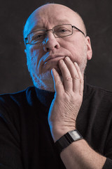 serious man with glasses