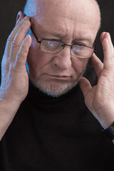 serious man with glasses