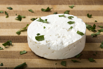 Feta cheese on wooden board