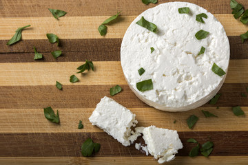 Feta cheese on wooden board