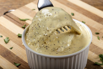 Herring fillets in mustard sauce and fork