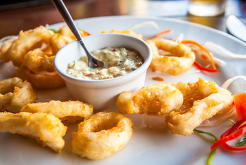 Deep fried calamari rings with sauce bowl