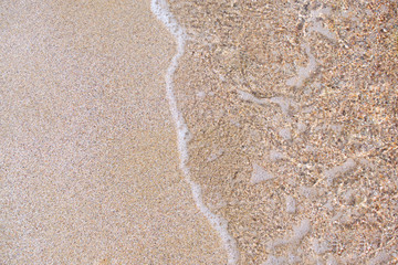 surf and white quartz sand the bottom of the sea background