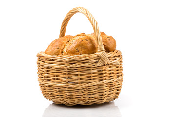 bread in wicker basket isolated on white