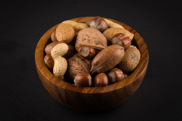 Mixed nuts in shells in a bowl