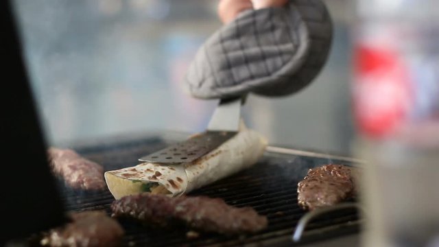 Cooking Turkish kyufta grilled