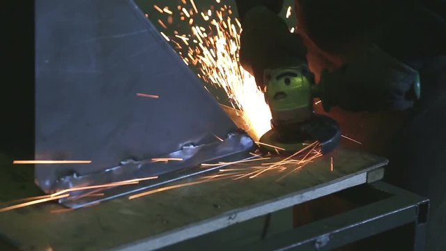 sparks from the grinder at a metal processing