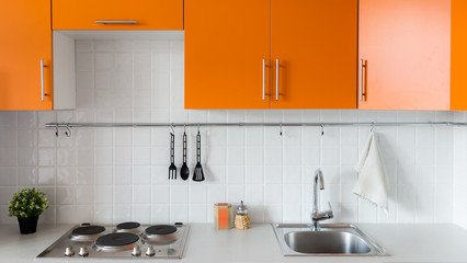 Fototapeta na wymiar Modern orange kitchen