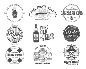 Set of vintage handcrafted emblems, labels, logos. Isolated on a white background. Sketching filled style. Pirate and sea symbols - old rum bottles, barrels, skull, pistol. Vector - obrazy, fototapety, plakaty