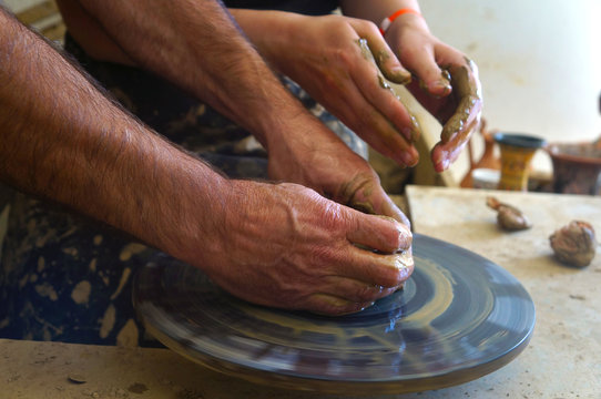 Teaching pottery with molding equipment.