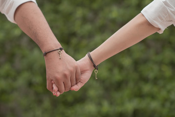 Happy couple holding hands
