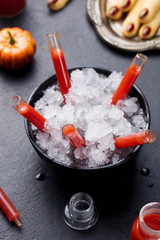 Bloody cocktail in glass tubes for Halloween party