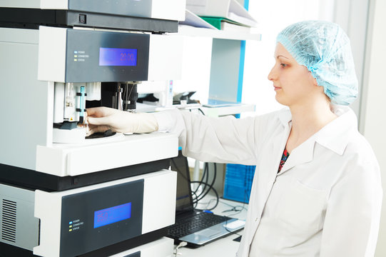 Female researcher analyzing liquid chromatography data