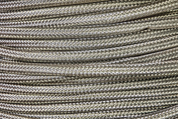 Flexible metal hose taken closeup as background.