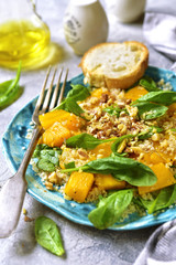 Pumpkin salad with quinoa,spinach and walnuts.