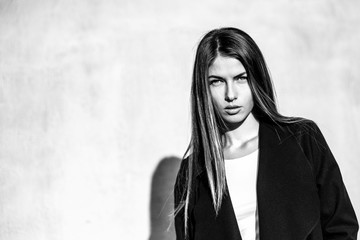 Black and white portrait of a beautiful girl . Young woman attentively looking into the camera.