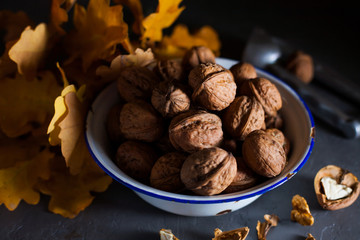 Walnuts in a bowl on a gray background