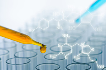 science laboratory test tubes with chemical formular