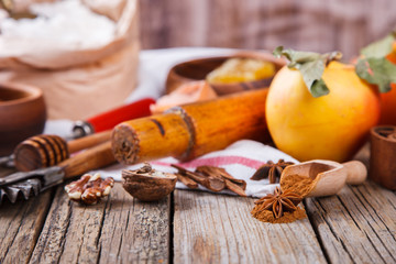 Baking Background. Ingredients  for baking Apple Pie  - apples,spices ,flour,  rolling pin, eggs, egg yolks, butter served.Vintage style.selective focus. Copy space.