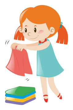 Little girl in blue dress folding clothes
