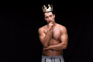 Ripped muscular man with king crown